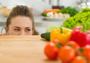 Young Woman Looking Out From Cutting Board And Looking On Vegeta